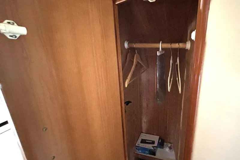  Yacht Photos Pics Wooden closet interior on 2003 Carver 396 Motor Yacht with hangers and storage.