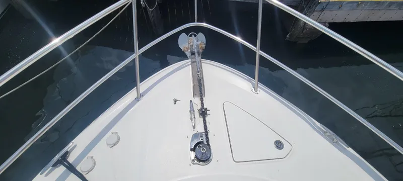  Yacht Photos Pics Bow view of 2004 Sea Ray 480 Sedan Bridge yacht with anchor and railings.