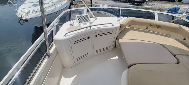  Yacht Photos Pics 2004 Sea Ray 480 Sedan Bridge boat interior with seating and storage compartments.