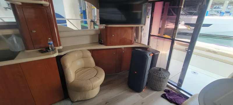  Yacht Photos Pics Interior of a 2004 Sea Ray 480 Sedan Bridge yacht with seating and TV.