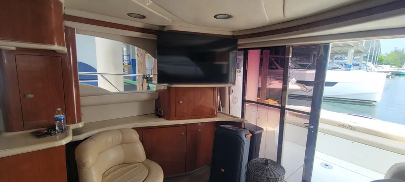  Yacht Photos Pics Interior of 2004 Sea Ray 480 Sedan Bridge yacht with TV and leather seating.