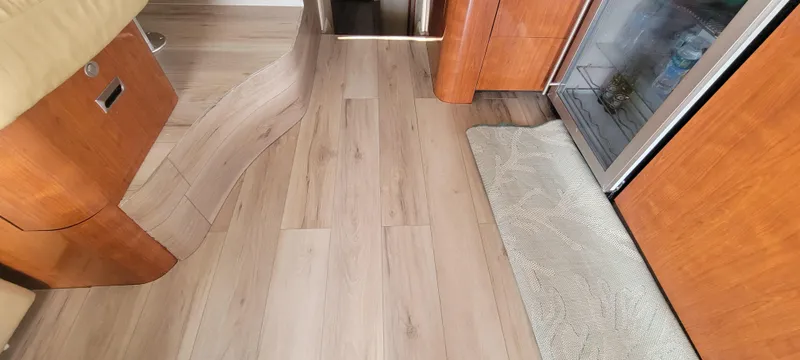  Yacht Photos Pics Interior flooring of a 2004 Sea Ray 480 Sedan Bridge yacht with wood finish.