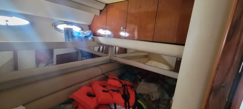  Yacht Photos Pics Interior cabin of a 2004 Sea Ray 480 Sedan Bridge with life jackets and storage cabinets.