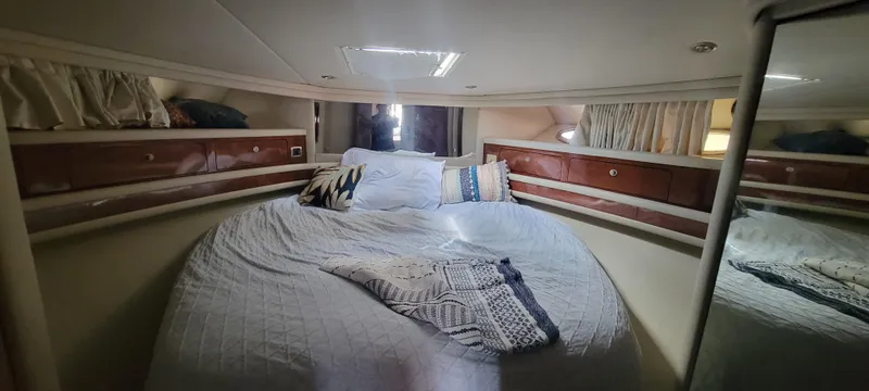  Yacht Photos Pics Luxurious bedroom in 2004 Sea Ray 480 Sedan Bridge yacht with cozy bedding.
