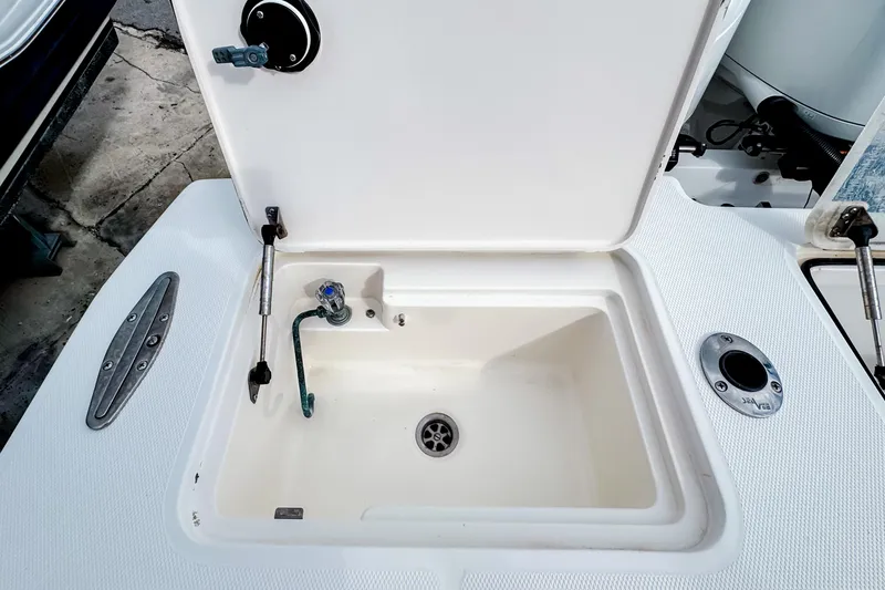  Yacht Photos Pics Open storage compartment on 2004 SeaVee 340i Cuddy boat deck.