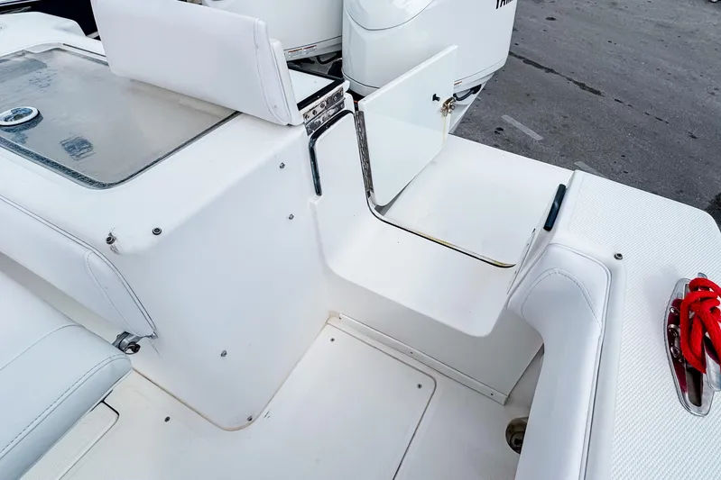  Yacht Photos Pics 2004 SeaVee 340i Cuddy boat interior with open storage compartment and seating.