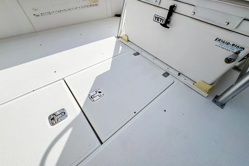  Yacht Photos Pics 2004 SeaVee 340i Cuddy deck with storage hatches and Yeti cooler.