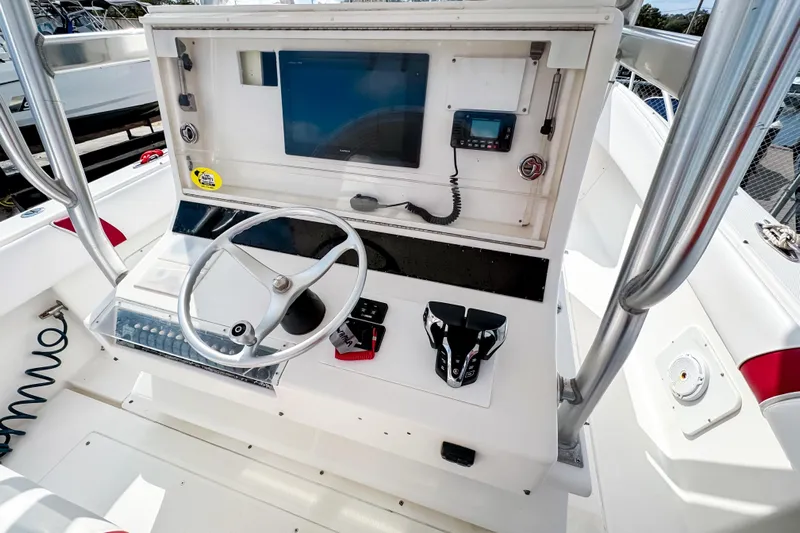  Yacht Photos Pics 2004 SeaVee 340i Cuddy boat helm with steering wheel and navigation controls.