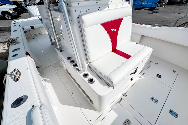  Yacht Photos Pics 2004 SeaVee 340i Cuddy boat interior with white and red seating.