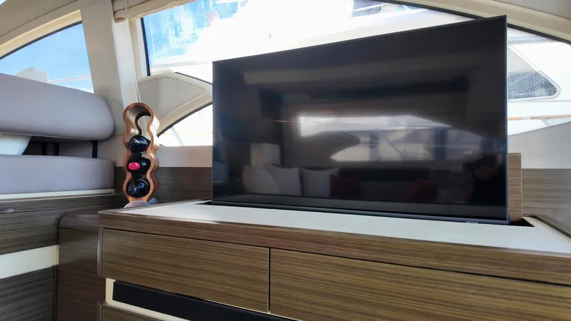  Yacht Photos Pics Luxurious interior of 2015 Azimut 54 Fly yacht with TV and wine rack.