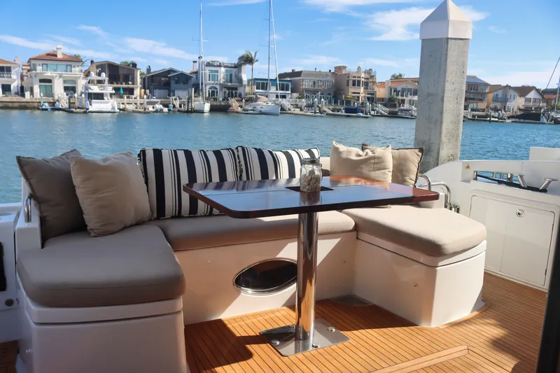  Yacht Photos Pics Luxurious seating area on 2015 Azimut 54 Fly yacht, overlooking marina with waterfront homes.