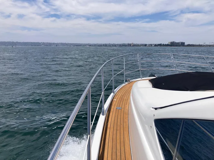  Yacht Photos Pics 2015 Azimut 54 Fly yacht cruising on open water under a cloudy sky.