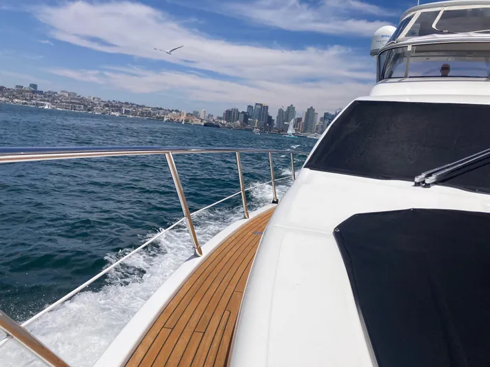  Yacht Photos Pics Azimut 54 Fly yacht cruising near city skyline, clear skies, 2015 model.