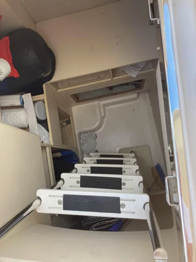  Yacht Photos Pics Interior view of 2015 Azimut 54 Fly yacht showing a ladder and storage area.