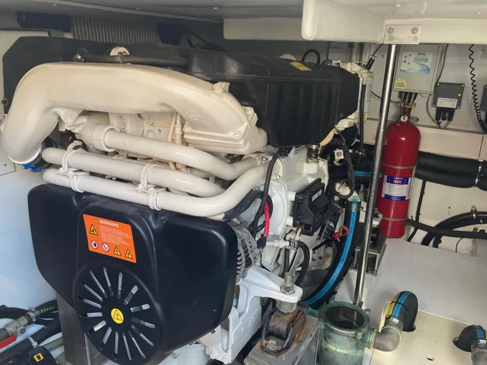  Yacht Photos Pics Engine room of 2015 Azimut 54 Fly yacht, featuring mechanical components and safety equipment.