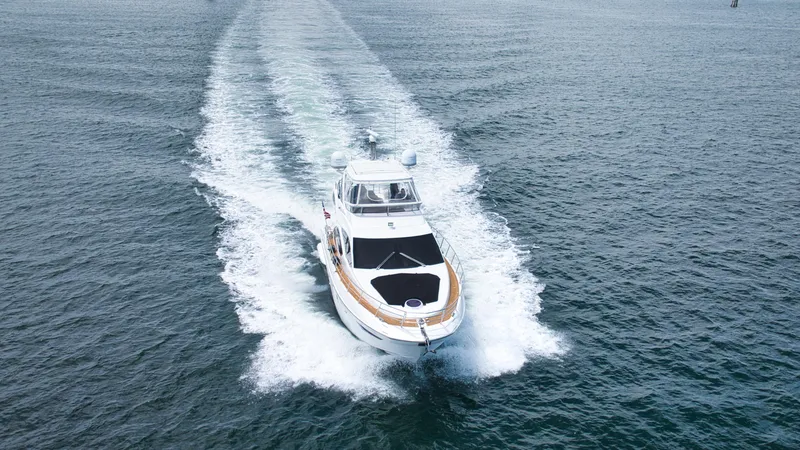  Yacht Photos Pics Azimut 54 Fly 2015 yacht cruising on open water, aerial view.