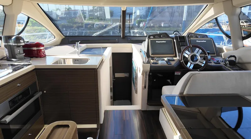  Yacht Photos Pics Luxurious interior of 2015 Azimut 54 Fly yacht with modern kitchen and helm station.