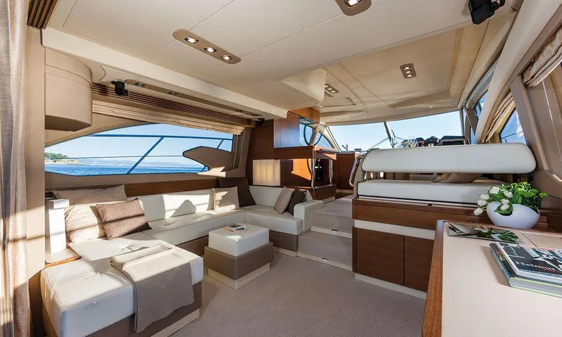 Yacht Photos Pics Luxurious interior of 2015 Azimut 54 Fly yacht with elegant seating and panoramic windows.