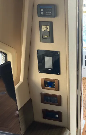 Yacht Photos Pics Control panel inside 2015 Azimut 54 Fly yacht, featuring various switches and displays.