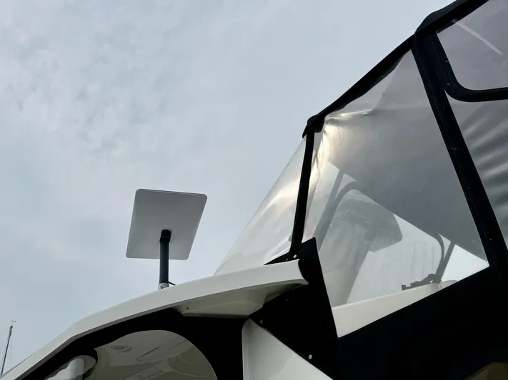  Yacht Photos Pics 1997 Silverton 402 Motor Yacht with satellite dish against cloudy sky.