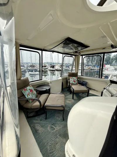  Yacht Photos Pics Interior of 1997 Silverton 402 Motor Yacht with comfortable seating and marina view.