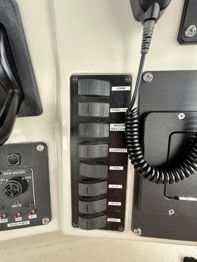  Yacht Photos Pics Control panel of a 1997 Silverton 402 Motor Yacht with labeled switches and microphone.