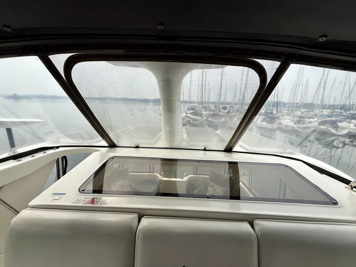  Yacht Photos Pics 1997 Silverton 402 Motor Yacht interior view with marina backdrop.