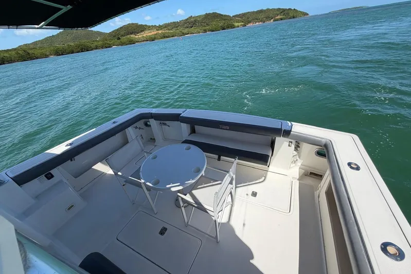  Yacht Photos Pics 1999 Tiara Yachts 4100 Open deck with seating, table, and ocean view.