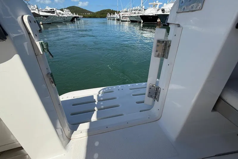  Yacht Photos Pics Open door on 1999 Tiara Yachts 4100 Open, overlooking marina with boats and water.