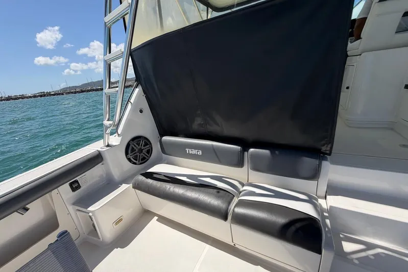  Yacht Photos Pics 1999 Tiara Yachts 4100 Open boat interior with black seating and ocean view.