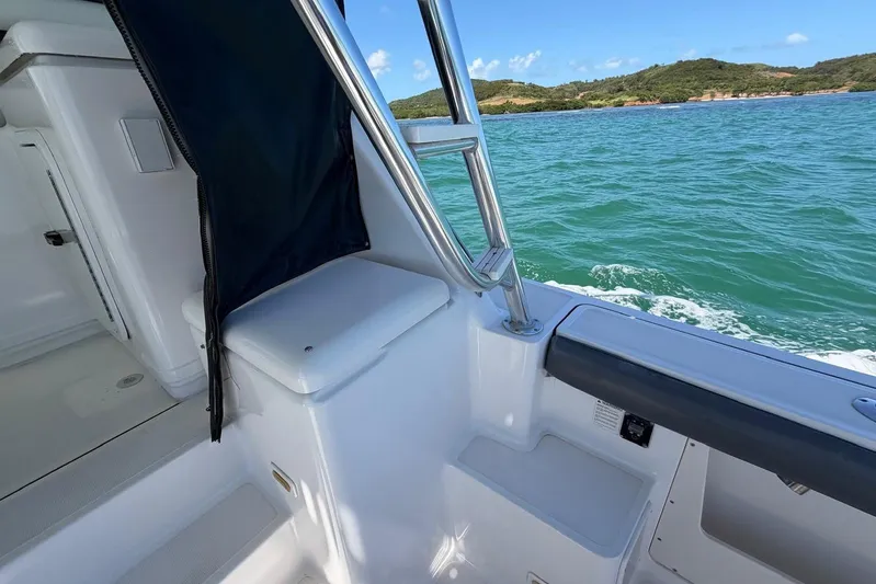  Yacht Photos Pics 1999 Tiara Yachts 4100 Open on water, showcasing interior and ocean view.