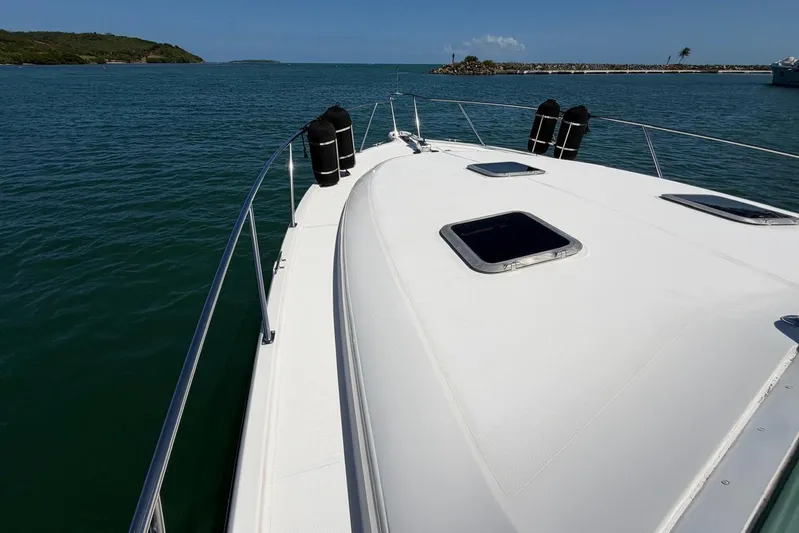  Yacht Photos Pics 1999 Tiara Yachts 4100 Open cruising on calm waters, showcasing sleek deck design.