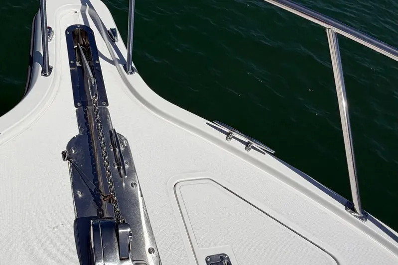 Yacht Photos Pics Bow of 1999 Tiara Yachts 4100 Open, featuring anchor chain and railing over water.