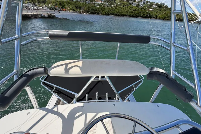  Yacht Photos Pics 1999 Tiara Yachts 4100 Open, helm view with water and shoreline in background.