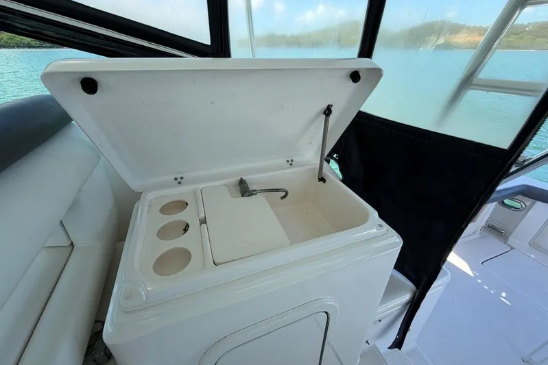  Yacht Photos Pics 1999 Tiara Yachts 4100 Open boat sink area with storage compartments.