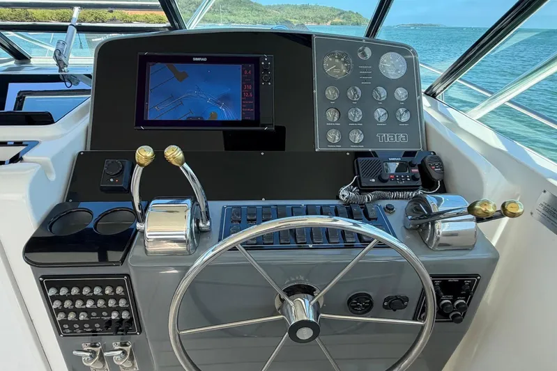  Yacht Photos Pics 1999 Tiara Yachts 4100 Open helm with navigation controls and ocean view.
