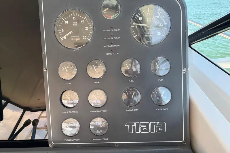  Yacht Photos Pics Instrument panel of a 1999 Tiara Yachts 4100 Open, featuring gauges and controls.