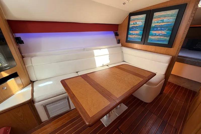  Yacht Photos Pics Luxurious interior of 1999 Tiara Yachts 4100 Open with elegant seating and artwork.