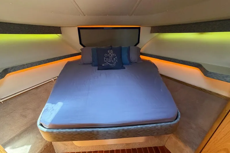  Yacht Photos Pics 1999 Tiara Yachts 4100 Open cabin with cozy bed and ambient lighting.