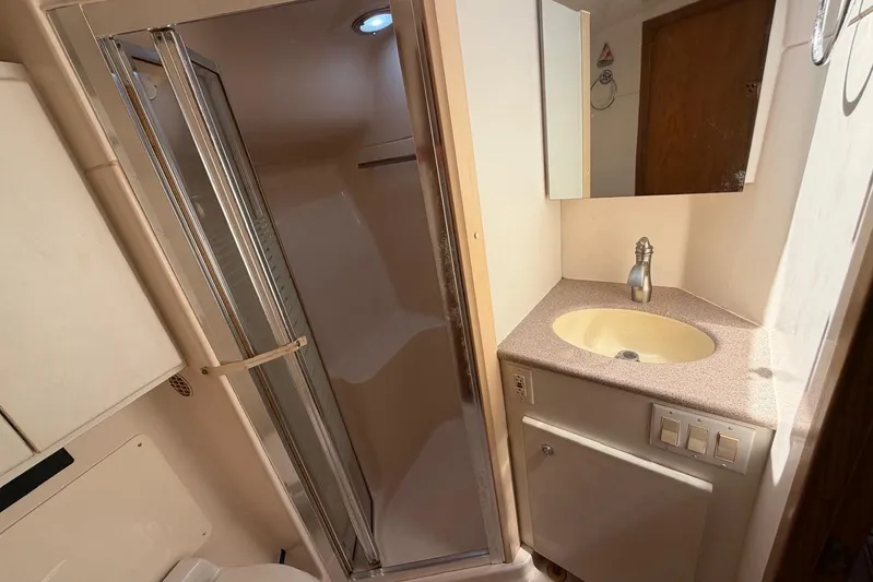  Yacht Photos Pics Bathroom interior of 1999 Tiara Yachts 4100 Open with shower and sink.