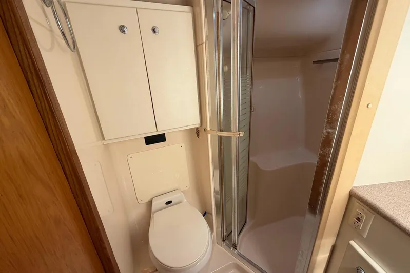  Yacht Photos Pics Bathroom interior of 1999 Tiara Yachts 4100 Open with shower and toilet.