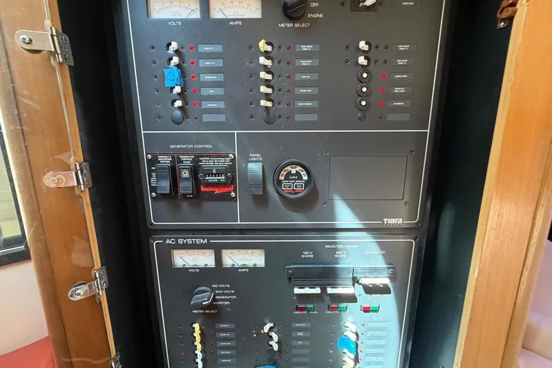  Yacht Photos Pics Electrical control panel of a 1999 Tiara Yachts 4100 Open, featuring volt and amp meters.