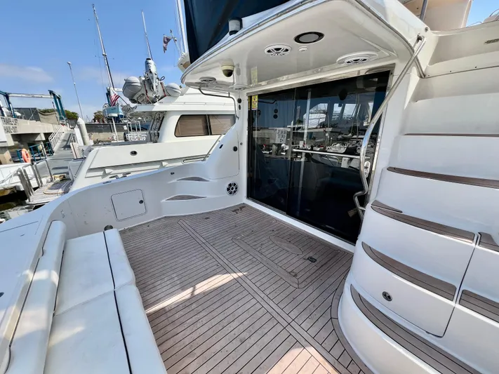 Bella Jolie Yacht Photos Pics 2002 Sea Ray 560 Sedan Bridge yacht with spacious deck and elegant design.