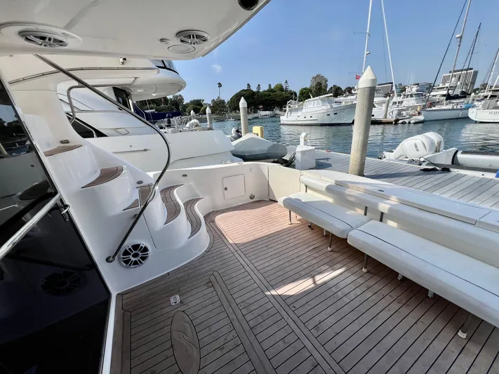 Bella Jolie Yacht Photos Pics Luxurious 2002 Sea Ray 560 Sedan Bridge yacht docked, featuring spacious deck and elegant seating.