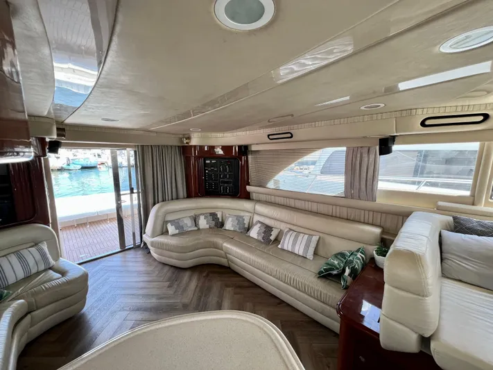 Bella Jolie Yacht Photos Pics Luxurious interior of a 2002 Sea Ray 560 Sedan Bridge yacht with elegant seating.