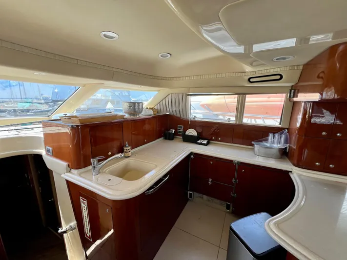 Bella Jolie Yacht Photos Pics Luxurious kitchen interior of 2002 Sea Ray 560 Sedan Bridge yacht.