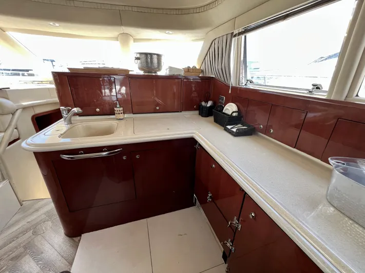 Bella Jolie Yacht Photos Pics Luxurious kitchen interior of 2002 Sea Ray 560 Sedan Bridge yacht.
