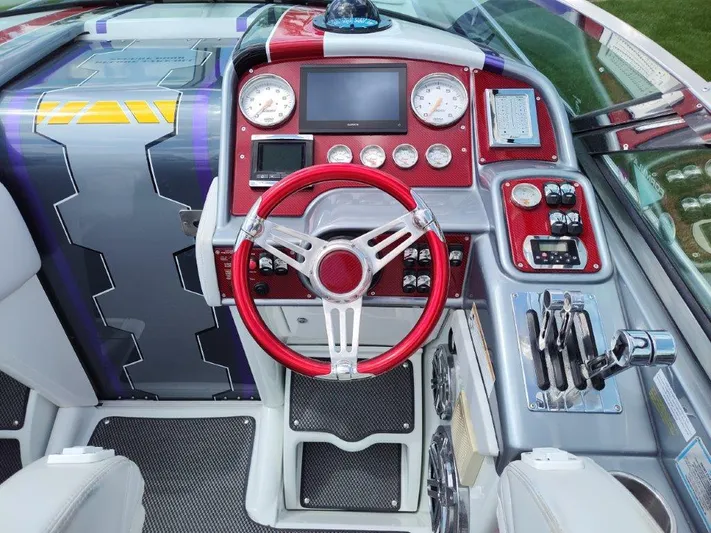  Yacht Photos Pics 2015 Formula 382 FASTech boat dashboard with red steering wheel and modern controls.