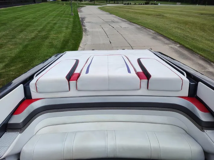  Yacht Photos Pics 2015 Formula 382 FASTech boat interior with white and red seating on a paved path.