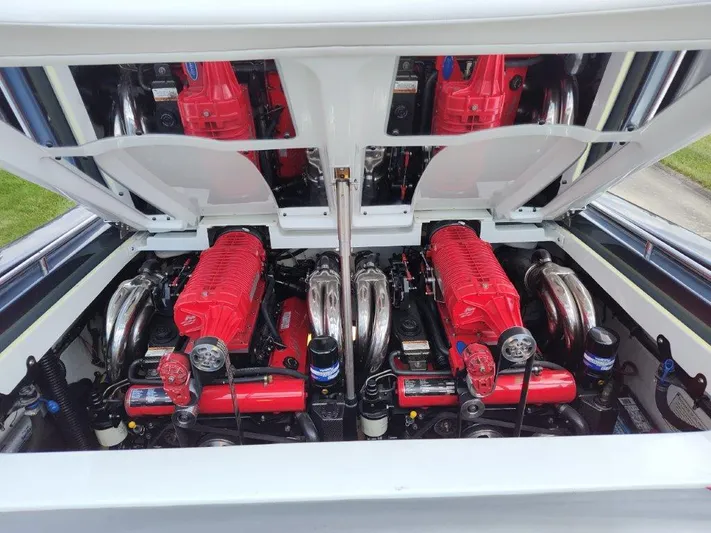  Yacht Photos Pics 2015 Formula 382 FASTech engine compartment with dual red engines and chrome components.
